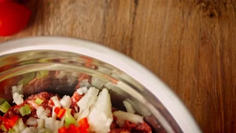 I put the bowl of minced meat on the table. 4k video slider Stock Footage 157289123