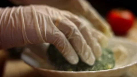 I put the burger balls over the flour .Tasty Low-Calorie Green Burgers. Food for Stock Footage 156723875