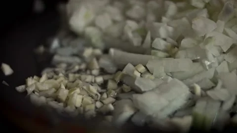 I put chopped garlic next to the fried onion. Falscher Hase recipe. 4k video Stock Footage 156764518