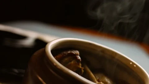 I put the duck pieces over the chickpeas. The duck gives steam and looks very Stock Footage 156450937