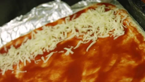 I put mozzarella on New York pizza Stock Footage 165072795