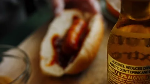 I put the mustard over the BBQ brats hot dog. 4k homemade video Stock Footage 159514403
