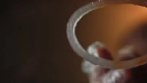 I put onions on the burger. Bottom filming through the glass. Taste Classic Vidéo 159626431