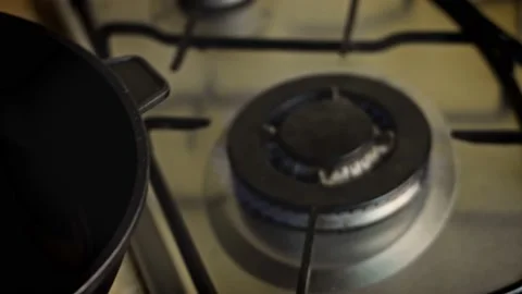 I put the pan on the fire. 4k video Stock Footage 157181824