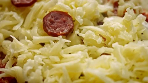 I put salami over the pide. We prepare pide with salami. 4k video Stock Footage 157297803