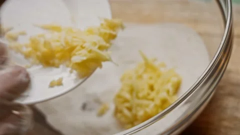 I put sliced apple to the ingredients for Bluberry Pie. 4k video Stock Footage 159981052