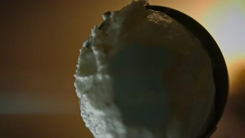 I put a sphere of ice cream. Bottom filming through the glass. 4k macro video Stock Footage 160562033