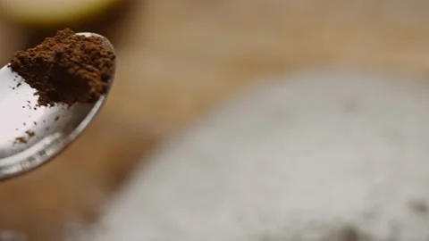 I put a spoonful of cinnamon on the ingredients. 4k video Stock Footage 159979792