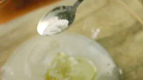 I put a spoonful of salt on the dough ingredients Stock Footage 165066987