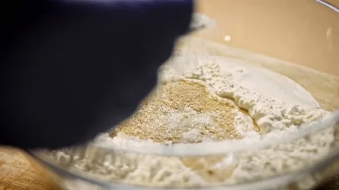 I put a spoonful of sugar over the dough. 4k video Stock Footage 157285831