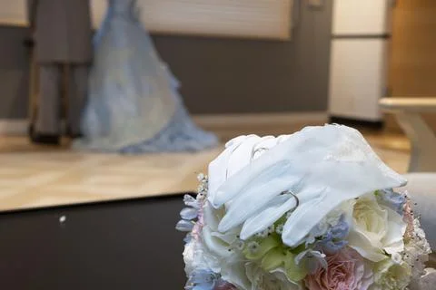 I put a wedding ring on the bride and groom's gloves Stock Photos