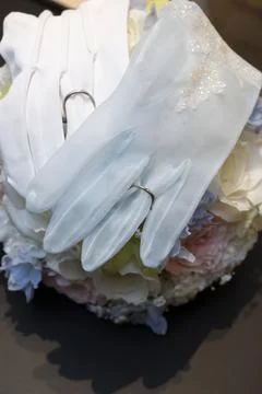 I put a wedding ring on the bride and groom's gloves Stock Photos