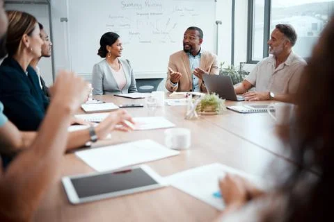 I said the same thing to them. a group of businesspeople listening to a Stockfoto's