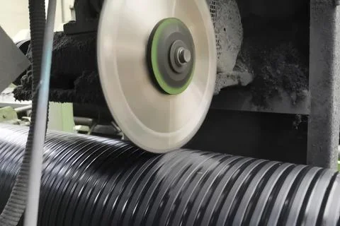I sawed black polypropylene pipe with a saw blade. Stock Photos