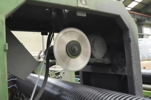 I sawed black polypropylene pipe with a saw blade. Stock Photos