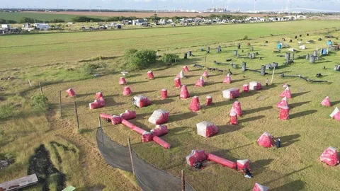 I sent my drone in orbit while my friends and I were playing paintball. It Stock Footage 123103490