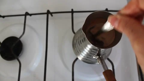 I stir the coffee while cooking on the stove 動画素材 155144673