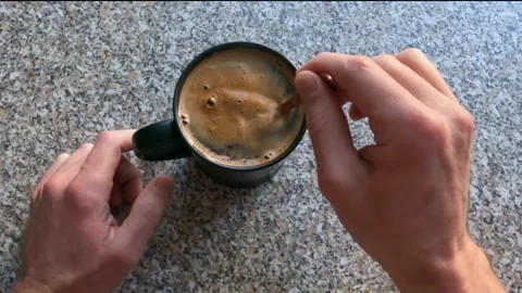 I stir my coffee with a teaspoon 2 Stock Footage 332428021