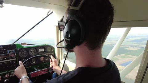 I student pilot practices flying and airplane. Stock Footage 162047192