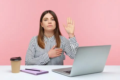 I swear! Honest dedicated woman office worker raising hand to give promise si Stock Photos