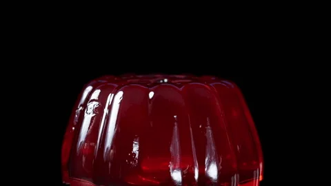 I swing the spoon and hit the Red Jelly, first from the side, then from above. C Stock Footage 232781104