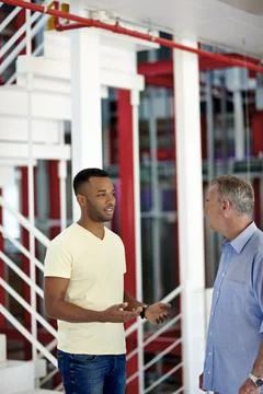 I think Im capable of taking the lead. two coworkers discussing something in a Stock Photos