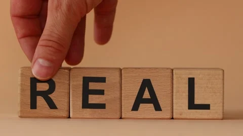 I turn over the wooden cube with the words 'Real heal'. Medical and real  Stock Footage 282670442
