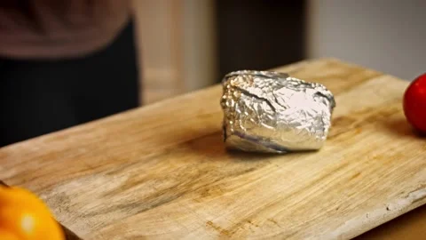 I unpack the cooked beets from the aluminum foil. Tasty Recipe Red Pizza for New Stock Footage 156745819
