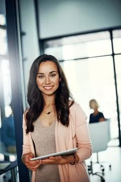 I use apps regularly to help simplify business. Portrait of a confident young Stock Photos