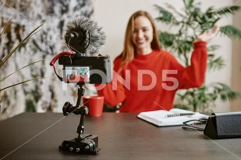 I want your likes! Portrait of cheerful young broadcasting a new tutorial for Stock Photos