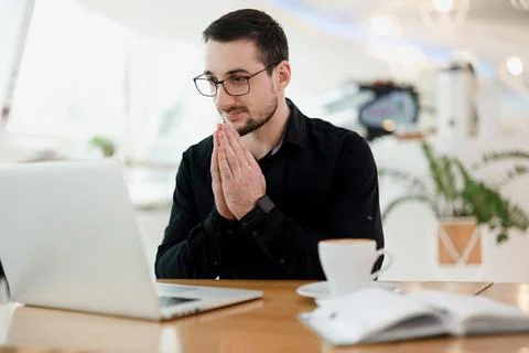 I will hope the code will work Young concentrated programmer holding his hands Stock Photos