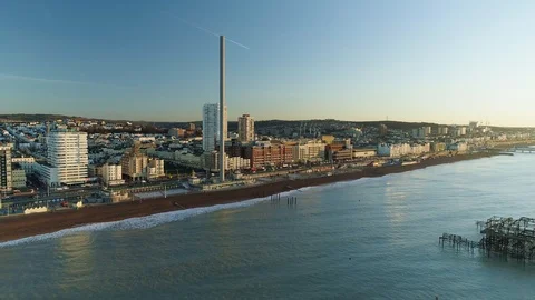 I360 viewing tower with Brighton West Pier, descending view, drone aerial 4K Stock Footage 101202606