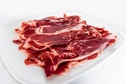 Iberian ham isolated in white background Stock Photos