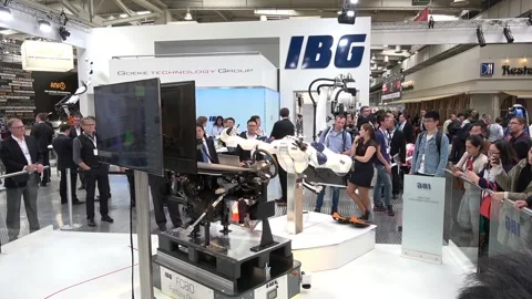 IBG presenting robot and human collaboration on Messe fair in Hannover, Germany Stock Footage 97788053