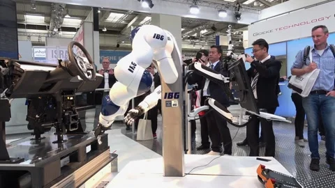 IBG presenting robot and human collaboration on Messe fair in Hannover, Germany Stock Footage 97788284
