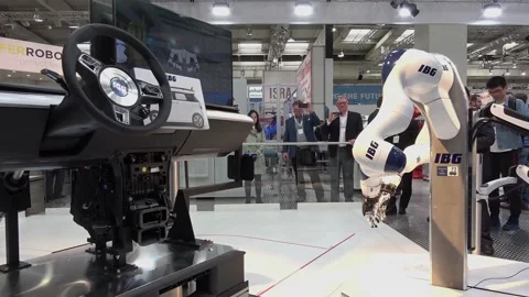 IBG presenting robot and human collaboration on Messe fair in Hannover, Germany Stock Footage 97788471