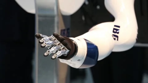 IBG presenting robot and human collaboration on Messe fair in Hannover, Germany Stock Footage 97789803