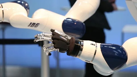 IBG presenting robot and human collaboration on Messe fair in Hannover, Germany Stock Footage 97789854