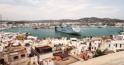 Ibiza Spain, July 2018: Timelapse of ibiza cruise ship arriving in port harbor Stock Footage 153068341