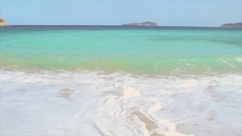 Ibiza, waves on beach in slow motion Video stock 83044066