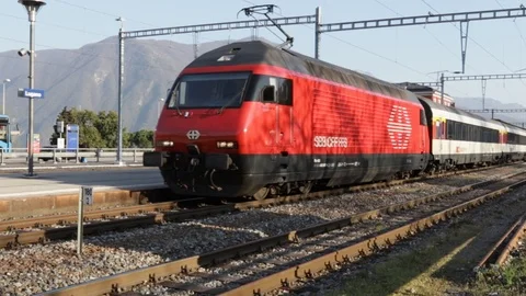IC SBB CFF FFS train departing from Lugano Stock Footage 105638194