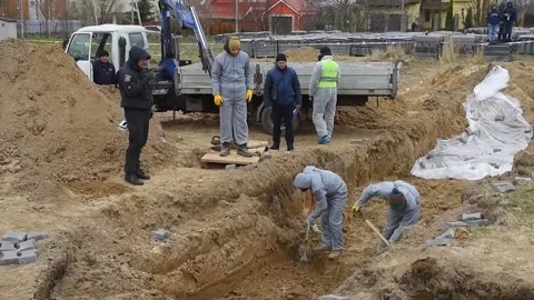 ICC chief prosecutor visits a mass grave in Bucha, UCRANIA, UA - 13 Apr 2022 Stock Footage 204119738