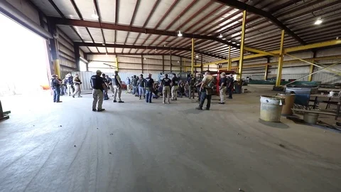 ICE agents execute seach warrants at workplace factory Video stock 94324358