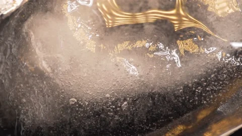Ice with air bubbles illuminated with colored light Stock Footage 135880404