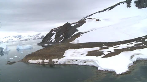 Ice and bare rock meet the sea, Antarctica Stock Footage 34312078