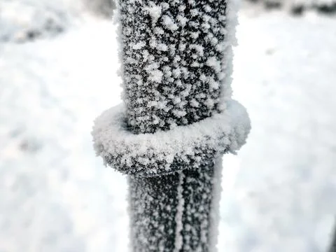 Ice and snow on a fence in winter Stock Photos