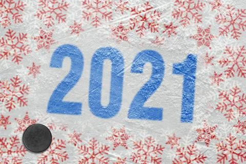 Ice arena with winter pattern and hockey puck Foto stock