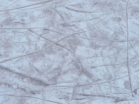 Ice background with marks from skating and hockey. Stock Photos