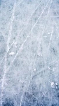Ice background with marks from skating and hockey, blue texture of rink surface Stock Photos
