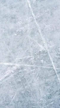 Ice background with marks from skating and hockey, blue texture of rink surface Stock Photos